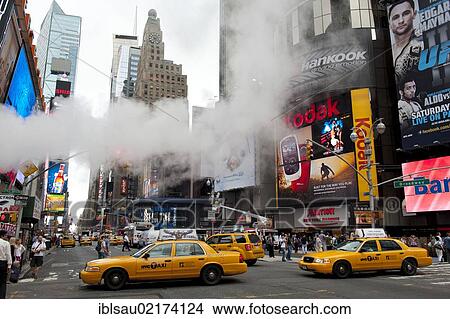 Metropolis, traffic, high-rise buildings and bright neon advertising signs, steam in the street, yellow cabs, taxis, intersection of Broadway and 7th Avenue, Times Square, Midtown, Manhattan, New York City, USA, North America, America, North America View Large Photo Image Picture - Metropolis, traffic, high-rise buildings and bright neon advertising signs, steam in the street, yellow cabs, taxis, intersection of Broadway and 7th Avenue, Times Square, Midtown, Manhattan, New York City, USA, North America, America, North America. Fotosearch