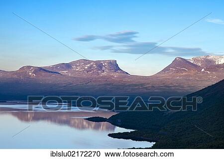 Stock Image - Midnight sun at the Tornetraesk with the Lapporten mountain, Abisko National Park, Lapland, northern Sweden, Sweden, Scandinavia, Europe. Fotosearch