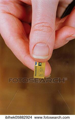 Picture - Mini credit card, money, funny, Berlin, Germany, Europe. Fotosearch