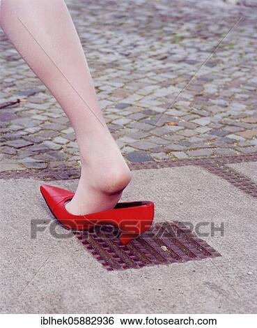 Misfortune, woman gets stuck in a hole with high heels, Berlin, Germany, Europe View Large Photo Image Stock Photograph - Misfortune, woman gets stuck in a hole with high heels, Berlin, Germany, Europe. Fotosearch