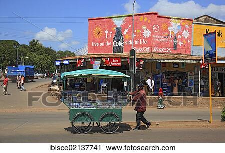 Stock Image - Mobile dealer for CDs in the centre of the town of Moshi, Tanzania, Africa. Fotosearch