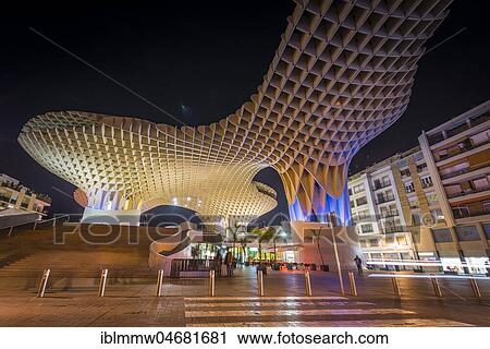 Stock Image - Modern architecture, wooden structure Metropol Parasol, illuminated, with traces of light at night, Plaza de la Encarnacion, Sevilla, Andalusia, Spain, Europe. Fotosearch