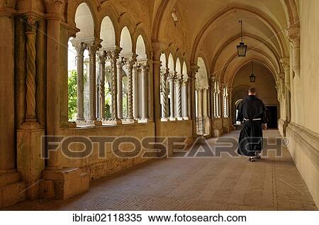 Monk walking in the cloister with double columns of the Gothic basilica of the Cistercian monastery Fossanova Abbey, near Priverno, Lazio, Italy, Europe View Large Photo Image Stock Photography - Monk walking in the cloister with double columns of the Gothic basilica of the Cistercian monastery Fossanova Abbey, near Priverno, Lazio, Italy, Europe. Fotosearch