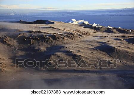 Stock Image - Morning fog in the crater of Mount Kilimanjaro, Tanzania, Africa. Fotosearch