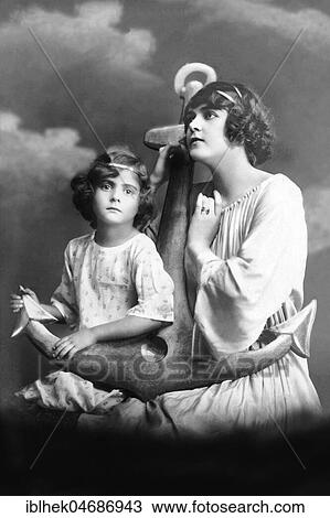 Mother and daughter pose with anchor and hope that the father returns healthy from the sea, 1910s, Germany, Europe View Large Photo Image Stock Image - Mother and daughter pose with anchor and hope that the father returns healthy from the sea, 1910s, Germany, Europe. Fotosearch