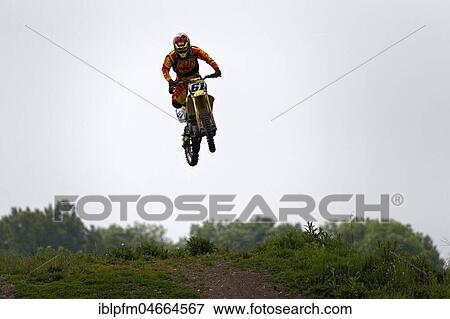 Motocross rider performing a stunt, Munich, Upper Bavaria, Germany, Europe View Large Photo Image Stock Photo - Motocross rider performing a stunt, Munich, Upper Bavaria, Germany, Europe. Fotosearch