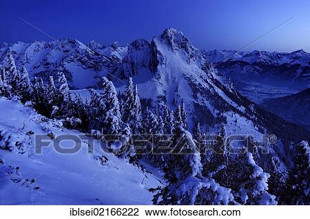 Stock Image - Mountain peaks at the blue hour, Pfronten, Allgaeu, Bavaria, Germany, Europe. Fotosearch