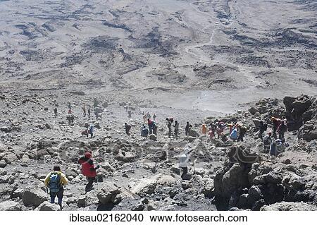 Mountaineering, mass tourism, many mountaineers during the dusty descent from Gilman's or Gillman's Point to Kibo Hut, summit of Mount Kilimanjaro, Marangu Route, Tanzania, East Africa, Africa View Large Photo Image Stock Image - Mountaineering, mass tourism, many mountaineers during the dusty descent from Gilman's or Gillman's Point to Kibo Hut, summit of Mount Kilimanjaro, Marangu Route, Tanzania, East Africa, Africa. Fotosearch