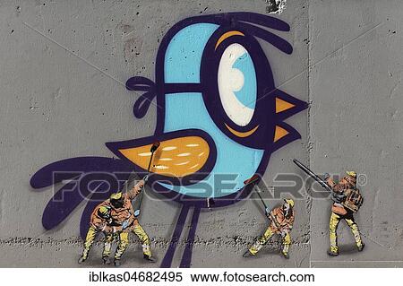 Stock Photography - Mural, bird gets cleaned by men, Belgian street art artists Bué and Jaune, The Crystal Ship Festival 2018, Ostend, Flanders, Belgium, Europe. Fotosearch