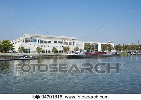 Music and Congress Hall with Theatre Ship, River Trave, Lübeck, Baltic Sea, Schleswig-Holstein, Germany, Europe View Large Photo Image Stock Photograph - Music and Congress Hall with Theatre Ship, River Trave, Lübeck, Baltic Sea, Schleswig-Holstein, Germany, Europe. Fotosearch
