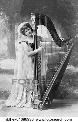 Music, woman playing harp, 1910s, Germany, Europe View Large Photo Image Stock Photograph - Music, woman playing harp, 1910s, Germany, Europe. Fotosearch