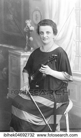 Musician, woman posing with violin, 1930s, Germany, Europe View Large Photo Image Stock Image - Musician, woman posing with violin, 1930s, Germany, Europe. Fotosearch
