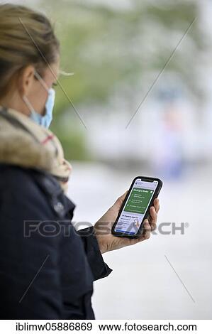Negative test result, woman with face mask, showing smartphone with Corona Warn-APP, Corona crisis, Stuttgart, Baden-Württemberg, Germany, Europe View Large Photo Image Stock Photo - Negative test result, woman with face mask, showing smartphone with Corona Warn-APP, Corona crisis, Stuttgart, Baden-Württemberg, Germany, Europe. Fotosearch