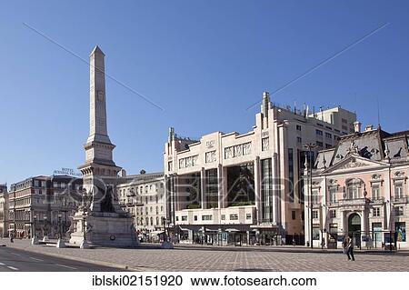 Stock Image - Obelisk on Praca dos Restauradores square with the former Eden Cinema, a cinema from the 30s Art Deco style, in the historic district of Rossio in Lisbon, Portugal, Europe. Fotosearch
