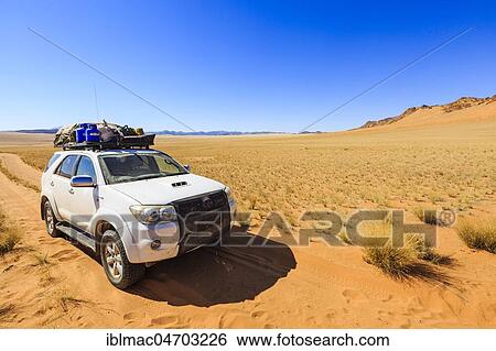 Stock Photograph - Off-road vehicle in Hartmann Valley, Kunene region, Namibia, Africa. Fotosearch