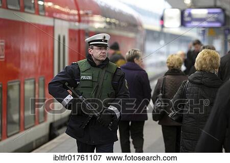 Officers of the Federal police walking the beat at the main railway station in Koblenz, Rhineland-Palatinate, Germany, Europe View Large Photo Image Stock Photo - Officers of the Federal police walking the beat at the main railway station in Koblenz, Rhineland-Palatinate, Germany, Europe. Fotosearch