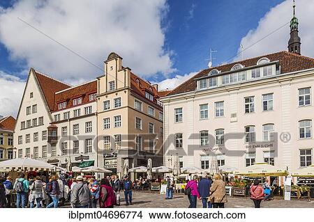 Old 18th century facades with terracotta roofs, market with tourists and souvenir vendors, Town Hall Square, Tallinn, Estonia, Europe View Large Photo Image Picture - Old 18th century facades with terracotta roofs, market with tourists and souvenir vendors, Town Hall Square, Tallinn, Estonia, Europe. Fotosearch