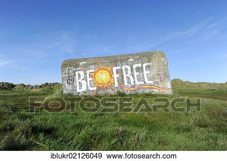 Stock Photo - Old bunker in the dunes, with the graffiti "Be Free", Fano island, Denmark, Scandinavia, Europe. Fotosearch