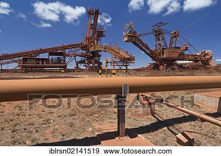 Stock Photo - Old industrial site of BHP Iron Ore, now called BHP Billion, a British-Australian mining group, Port Hedland, Western Australia, Australia, Oceania. Fotosearch