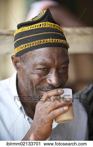 Old man drinking palm wine, Bamenda, Cameroon, Africa View Large Photo Image Stock Image - Old man drinking palm wine, Bamenda, Cameroon, Africa. Fotosearch