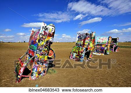 Painted Cadillacs rammed into the ground, public art installation Cadillac Ranch on Route 66, artist Stanley Marsh 3, Amarillo, Texas, USA, North America View Large Photo Image Stock Image - Painted Cadillacs rammed into the ground, public art installation Cadillac Ranch on Route 66, artist Stanley Marsh 3, Amarillo, Texas, USA, North America. Fotosearch