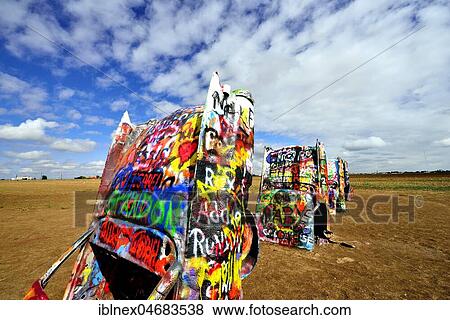 Painted Cadillacs rammed into the ground, public art installation Cadillac Ranch on Route 66, artist Stanley Marsh 3, Amarillo, Texas, USA, North America View Large Photo Image Stock Photo - Painted Cadillacs rammed into the ground, public art installation Cadillac Ranch on Route 66, artist Stanley Marsh 3, Amarillo, Texas, USA, North America. Fotosearch
