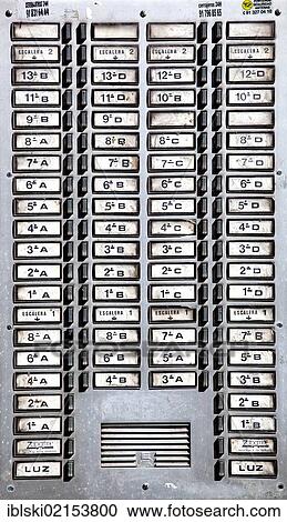 Stock Image - Panel with countless appartment buzzers on a residential house in Madrid, Spain, Europe. Fotosearch