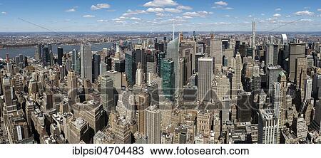Stock Image - Panoramic view of skycrapers around Times Square and Midtown Manhattan from Empire State Building, New York City, USA, North America. Fotosearch