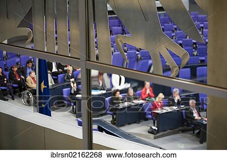 Parliamentary session in the Plenary Assembly Hall of the Reichstag building, part of the German federal eagle is in the foreground, Berlin, Germany, Europe View Large Photo Image Stock Photo - Parliamentary session in the Plenary Assembly Hall of the Reichstag building, part of the German federal eagle is in the foreground, Berlin, Germany, Europe. Fotosearch