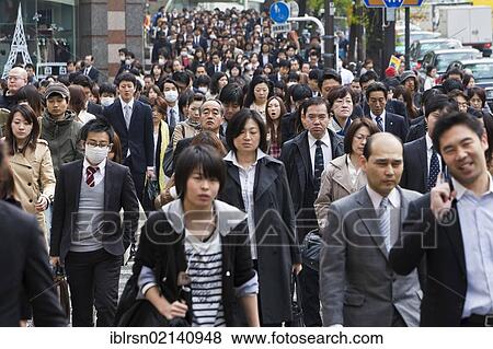 Stock Photo - Pedestrians during the morning rush hour in the business district of Shinjuku, Tokyo, Japan, Asia. Fotosearch