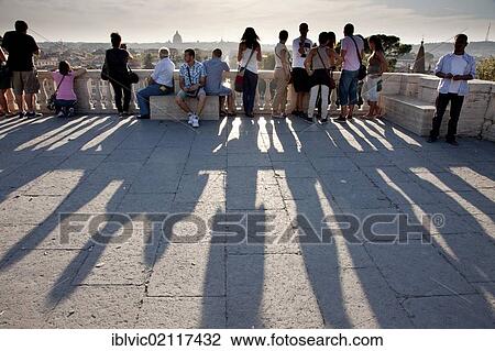 People casting long shadows in evening light, Piazza Napoleone I, on the Pincian Hill, Rome, Italy, Europe View Large Photo Image Stock Image - People casting long shadows in evening light, Piazza Napoleone I, on the Pincian Hill, Rome, Italy, Europe. Fotosearch