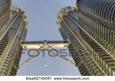 Stock Photo - Petronas Towers at dusk with moon, skybridge, Kuala Lumpur, Malaysia, Southeast Asia, Asia. Fotosearch
