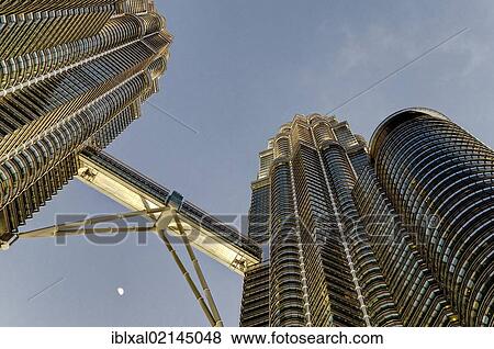 Petronas Towers at dusk with moon, skybridge, Kuala Lumpur, Malaysia, Southeast Asia, Asia View Large Photo Image Stock Photo - Petronas Towers at dusk with moon, skybridge, Kuala Lumpur, Malaysia, Southeast Asia, Asia. Fotosearch