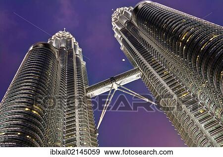 Stock Photo - Petronas Towers at night with moon, skybridge, Kuala Lumpur, Malaysia, Southeast Asia, Asia. Fotosearch