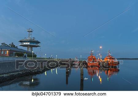 Pilot boats and control tower of the traffic control centre at the mouth of the Trave, Travemünde, Baltic Sea, Schleswig-Holstein, Germany, Europe View Large Photo Image Stock Photo - Pilot boats and control tower of the traffic control centre at the mouth of the Trave, Travemünde, Baltic Sea, Schleswig-Holstein, Germany, Europe. Fotosearch