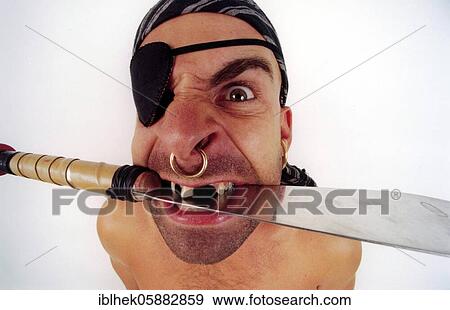 Stock Photo - Pirate, eye patch, nose ring, knife, Berlin, Germany, Europe. Fotosearch