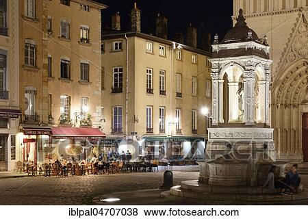 Stock Photo - Place Saint-Jean, fountain, night view, Lyon, Auvergne-Rhône-Alpes, France, Europe. Fotosearch