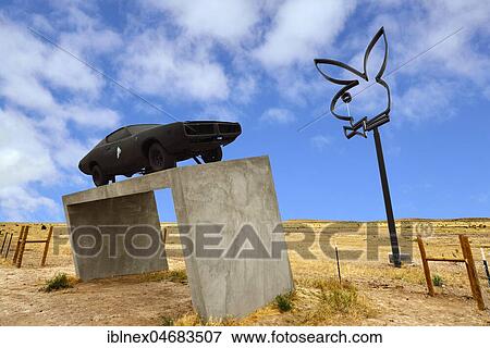 Stock Photo - Playboy Bunny and sports car on a concrete base, Marfa, Texas, USA, North America. Fotosearch