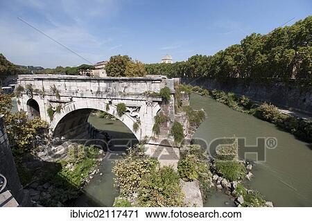 Stock Image - Ponte Rotto, old and already collapsed bridge at the Tiber Island, used to cross the Tiber river, Rome, Italy, Europe. Fotosearch