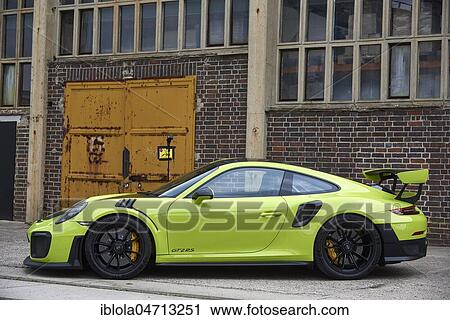 Stock Image - Porsche 991 GT2 RS, 2018, side view, in front of industrial scenery, Germany, Europe. Fotosearch