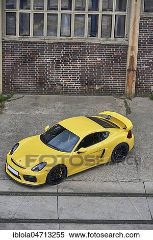 Stock Photography - Porsche Cayman GT 4, 2016, in front of industrial scenery, top view, Germany, Europe. Fotosearch