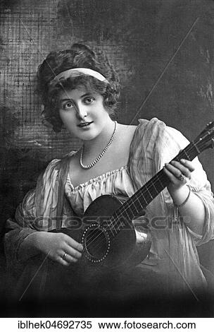 Portrait, musician, woman plays guitar, 1920s, Germany, Europe View Large Photo Image Stock Photography - Portrait, musician, woman plays guitar, 1920s, Germany, Europe. Fotosearch