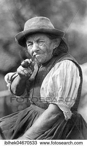 Portrait of an old woman smoking a pipe, the Plattenweible, 1930s, Germany, Europe View Large Photo Image Stock Image - Portrait of an old woman smoking a pipe, the Plattenweible, 1930s, Germany, Europe. Fotosearch