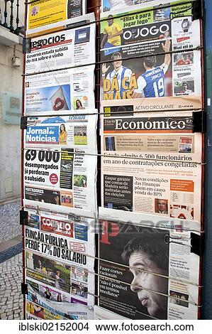 Picture - Portuguese and international newspapers at a newsstand in Lisbon, Portugal, Europe. Fotosearch