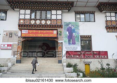 Stock Image - Post office, entrance to the main post office, picture of the royal couple on a wall, capital of Thimphu, the Himalayas, Kingdom of Bhutan, South Asia, Asia. Fotosearch