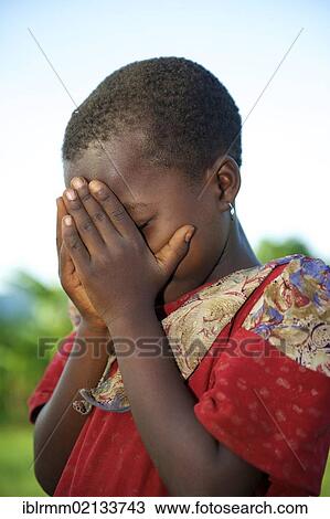 Stock Image - Praying girl, Bamenda, Cameroon, Africa. Fotosearch