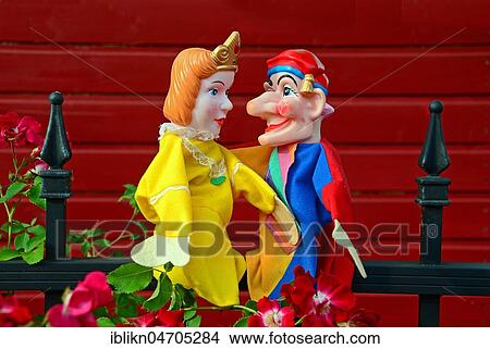 Punch puppets, Punch and Judy, princess, sitting on a metal fence View Large Photo Image Picture - Punch puppets, Punch and Judy, princess, sitting on a metal fence. Fotosearch