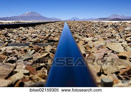 Railroad tracks with the Andes Mountains, Uyuni, Bolivia, South America View Large Photo Image Stock Photography - Railroad tracks with the Andes Mountains, Uyuni, Bolivia, South America. Fotosearch