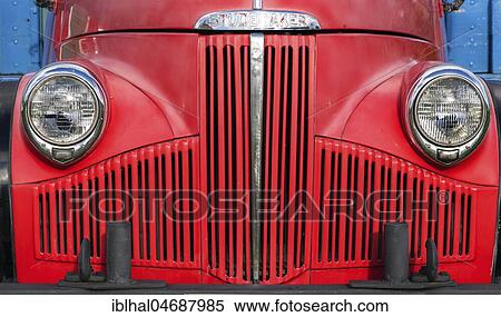 Stock Photography - Red bonnet, radiator grille and lamps, vintage Studebaker Truck, truck, 1948, Ystafell Transportation Museum, Samgönguminjasafnið Ystafelli, North Iceland, Iceland, Europe. Fotosearch