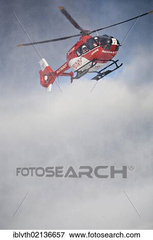 Rescue helicopter approaching, rescue operation with a rescue helicopter in the Thuringian Slate Mountains, Thuringia, Germany, Europe View Large Photo Image Stock Photo - Rescue helicopter approaching, rescue operation with a rescue helicopter in the Thuringian Slate Mountains, Thuringia, Germany, Europe. Fotosearch